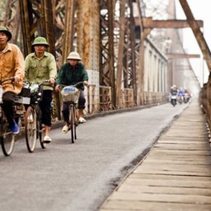 Cycling along Long Bien Bridge